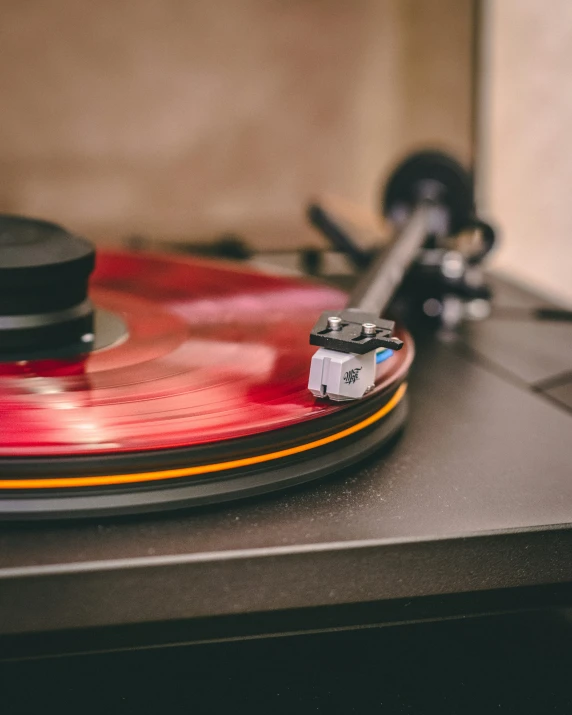 a turntable that is playing music on the table