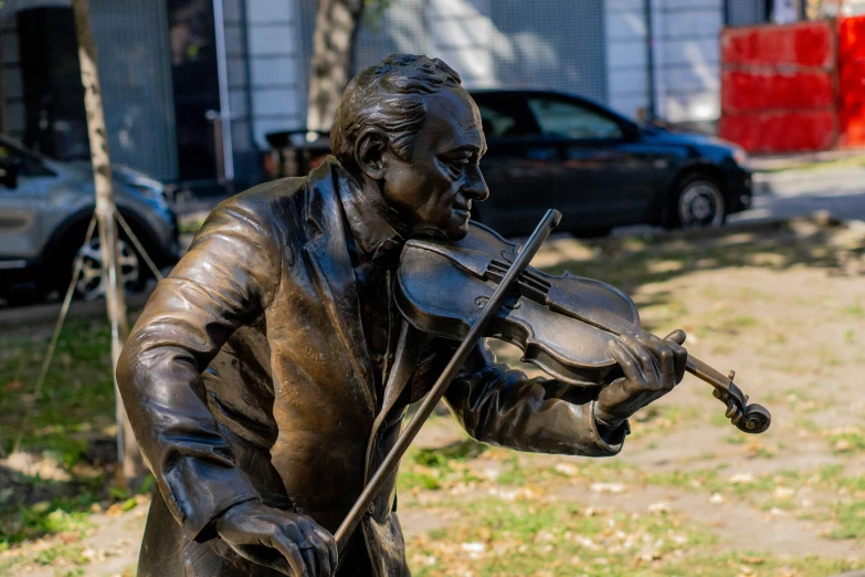 a statue of a man playing a violin