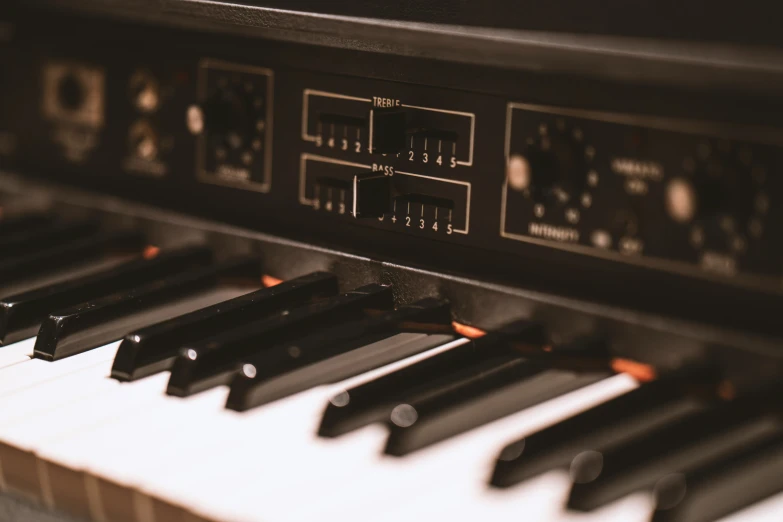 a closeup of an organ with the strings