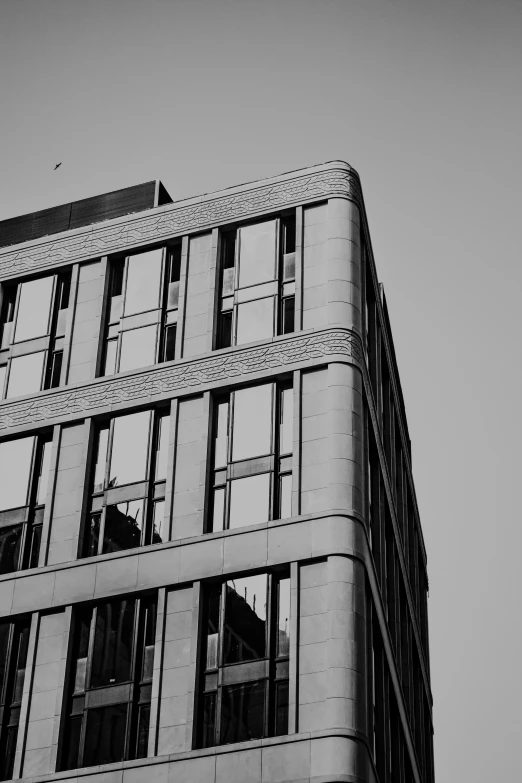 the building is gray in color and has a tall window