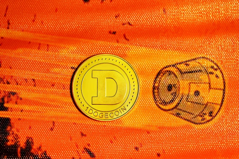 a closeup of an orange and yellow cloth with a token coin on it