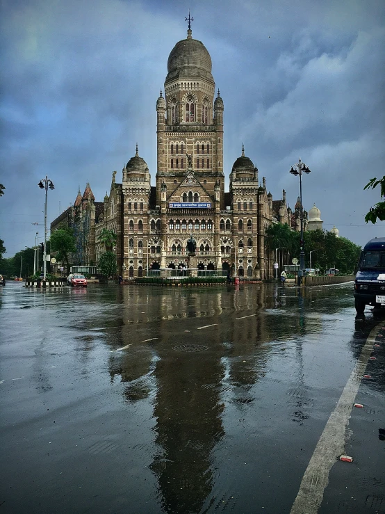 the water is reflecting the building on the other side