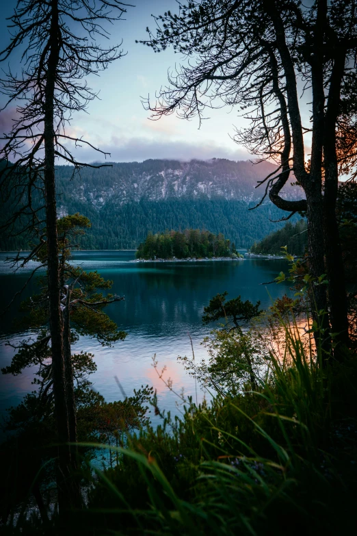 the sky is blue and hazy as it reflects in the water