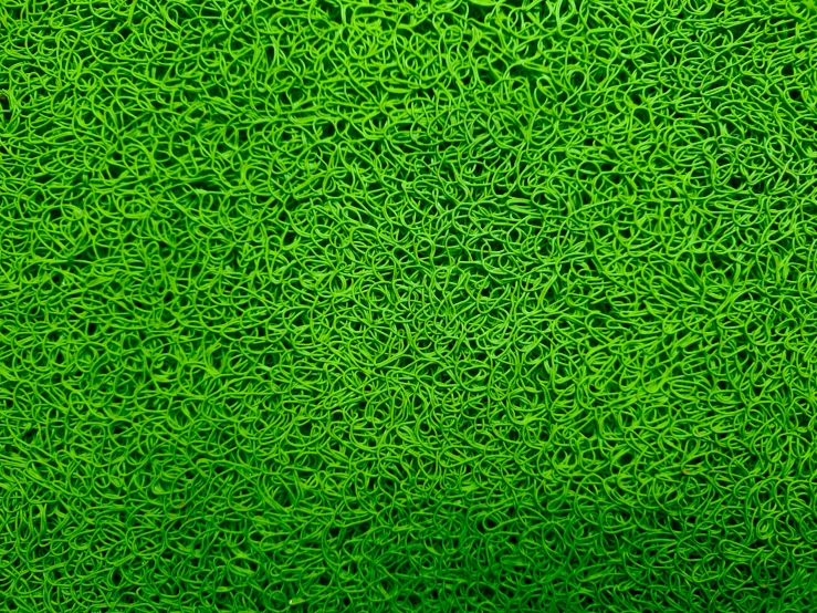 an abstract green painting with large, wavy patterns