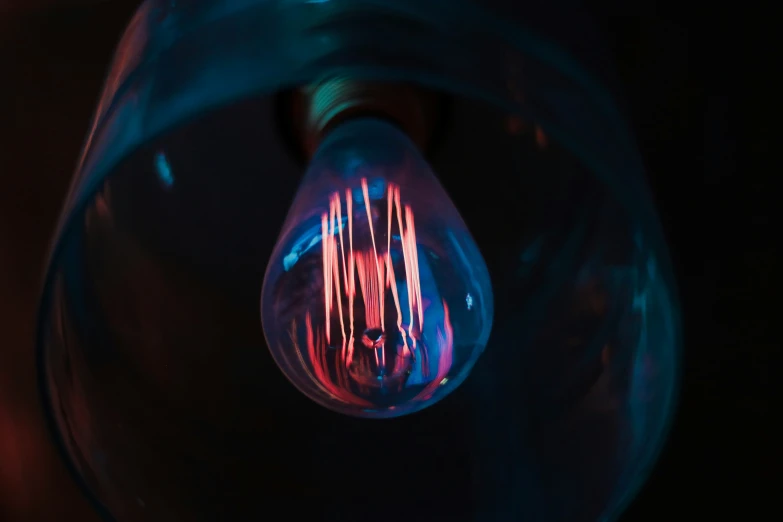 a large bulb lit up on a dark background