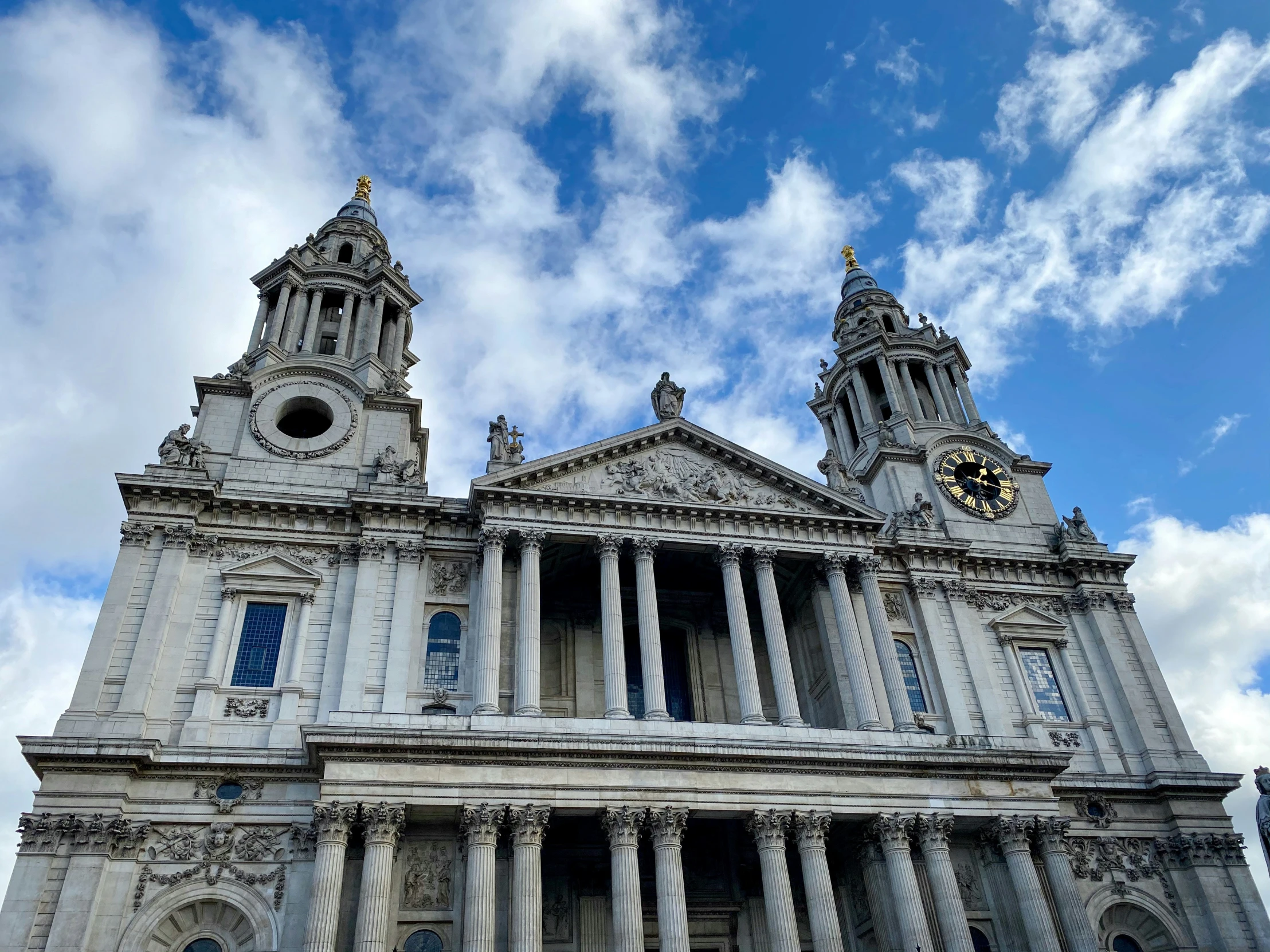 an old building has two towers with columns