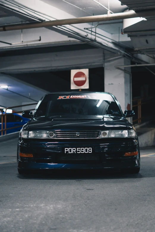 a very pretty car parked in a garage