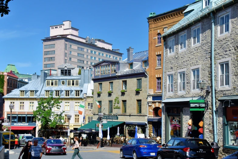 a street scene of a city with cars parked in the lot