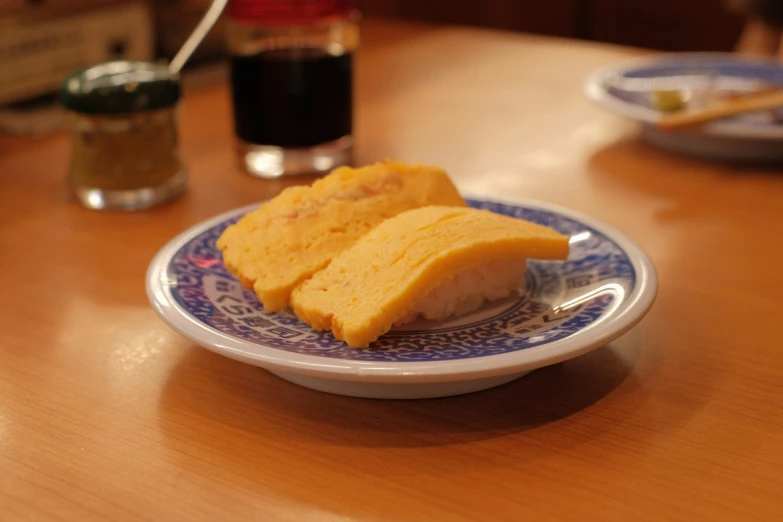 two pieces of fried food are sitting on a plate