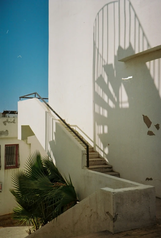 an empty staircase has a shadow on it