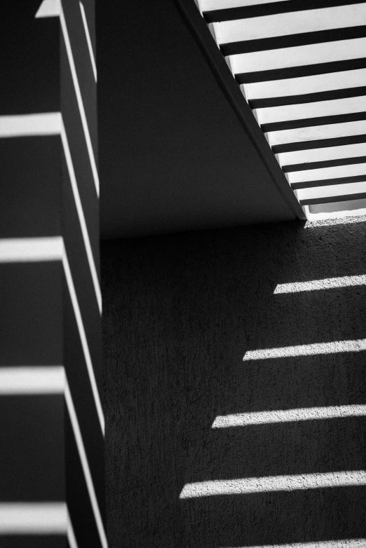 an angled view of a parking lot with white lines drawn on it