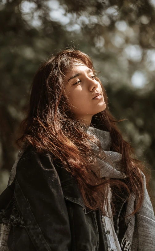 woman standing outside with her long hair out