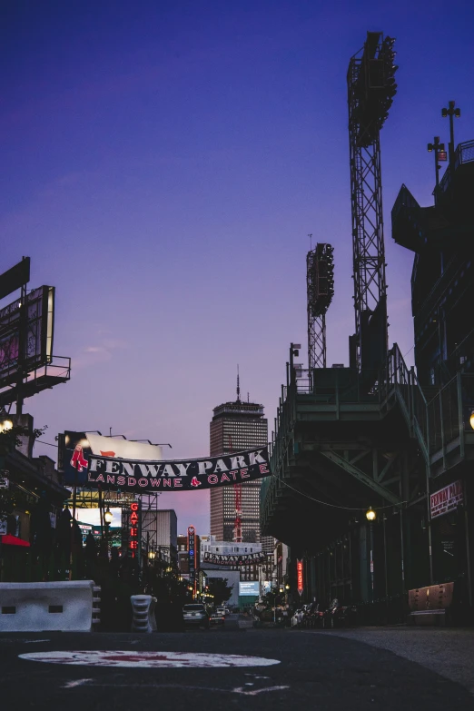 a baseball stadium at twilight as the sun sets