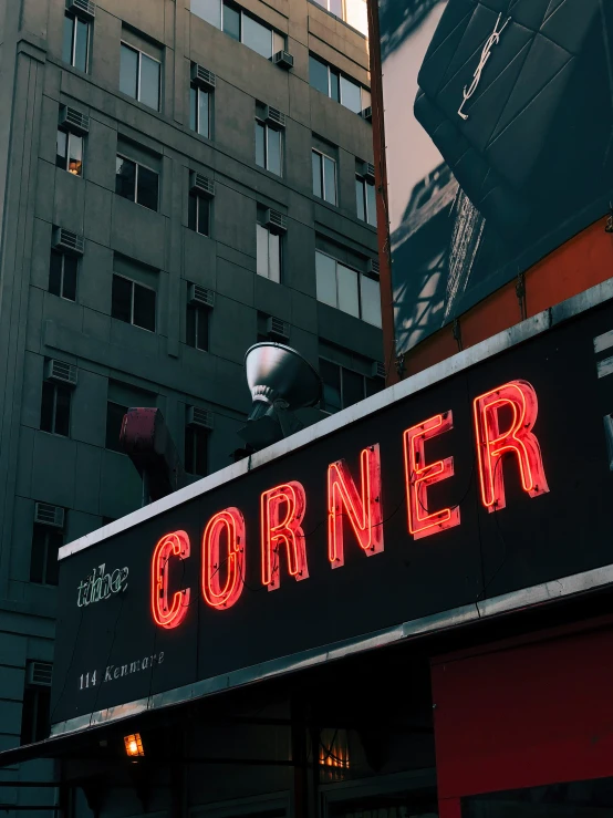 a building with a red sign that says corner