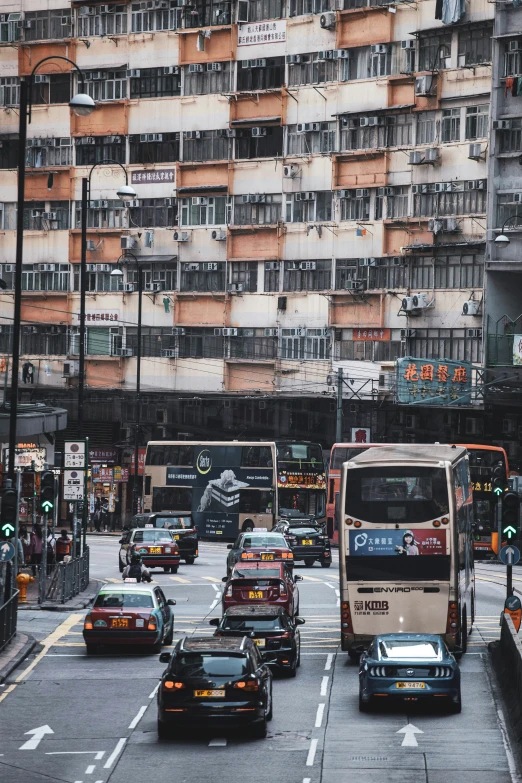 a city street with a large bus on the side