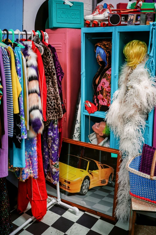 a colorful room with different clothing, hats, and clothing racks