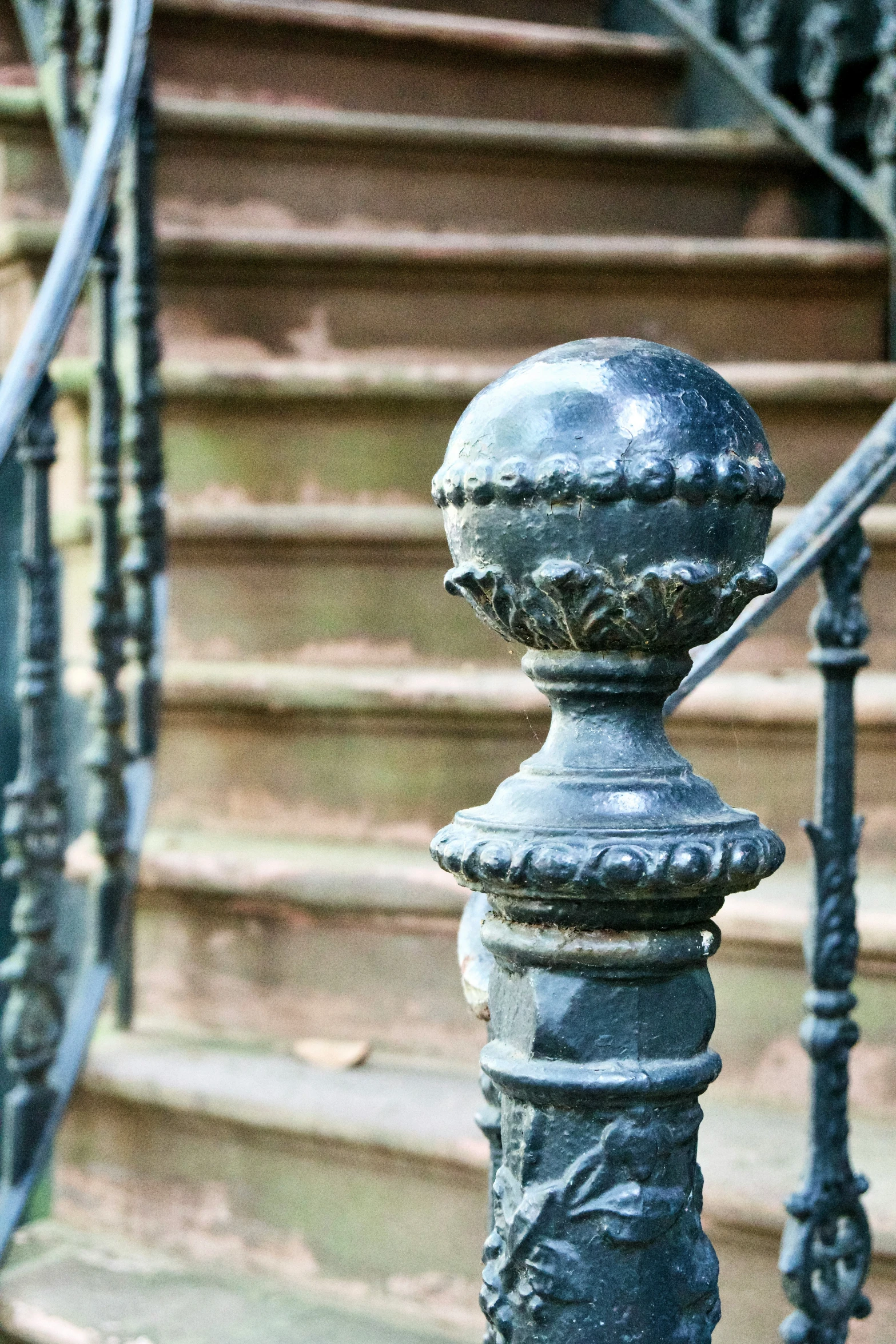 the bottom of a wrought iron staircase