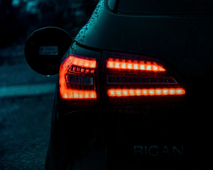 the rear lights of a black car
