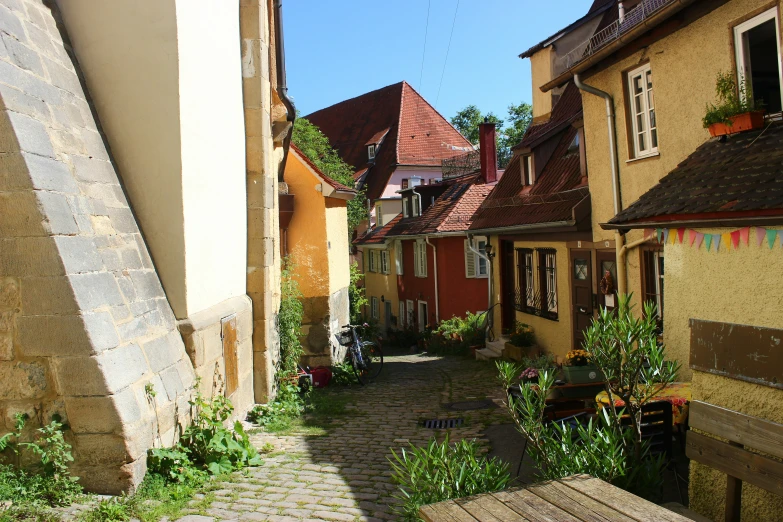 this is an old fashioned brick pathway leading to a home