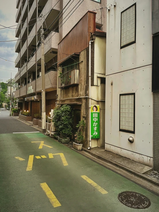 an empty street leads up to the entrance to a building