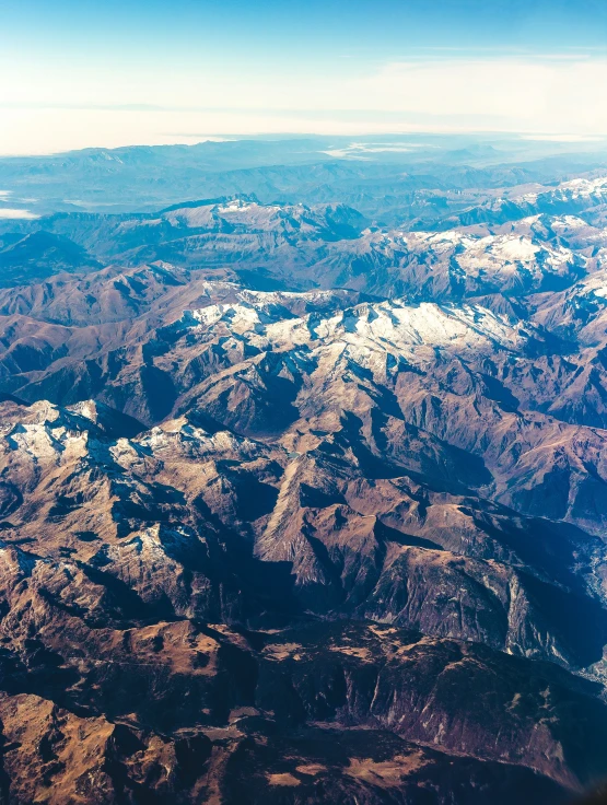 view from the airplane of the mountains