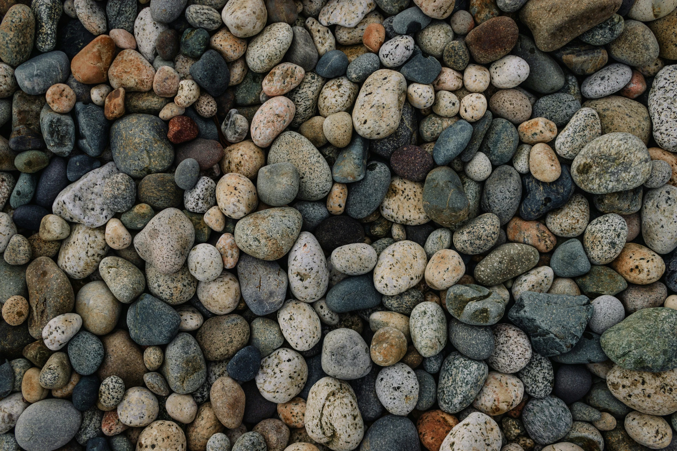 the rocks are all colorful and smooth