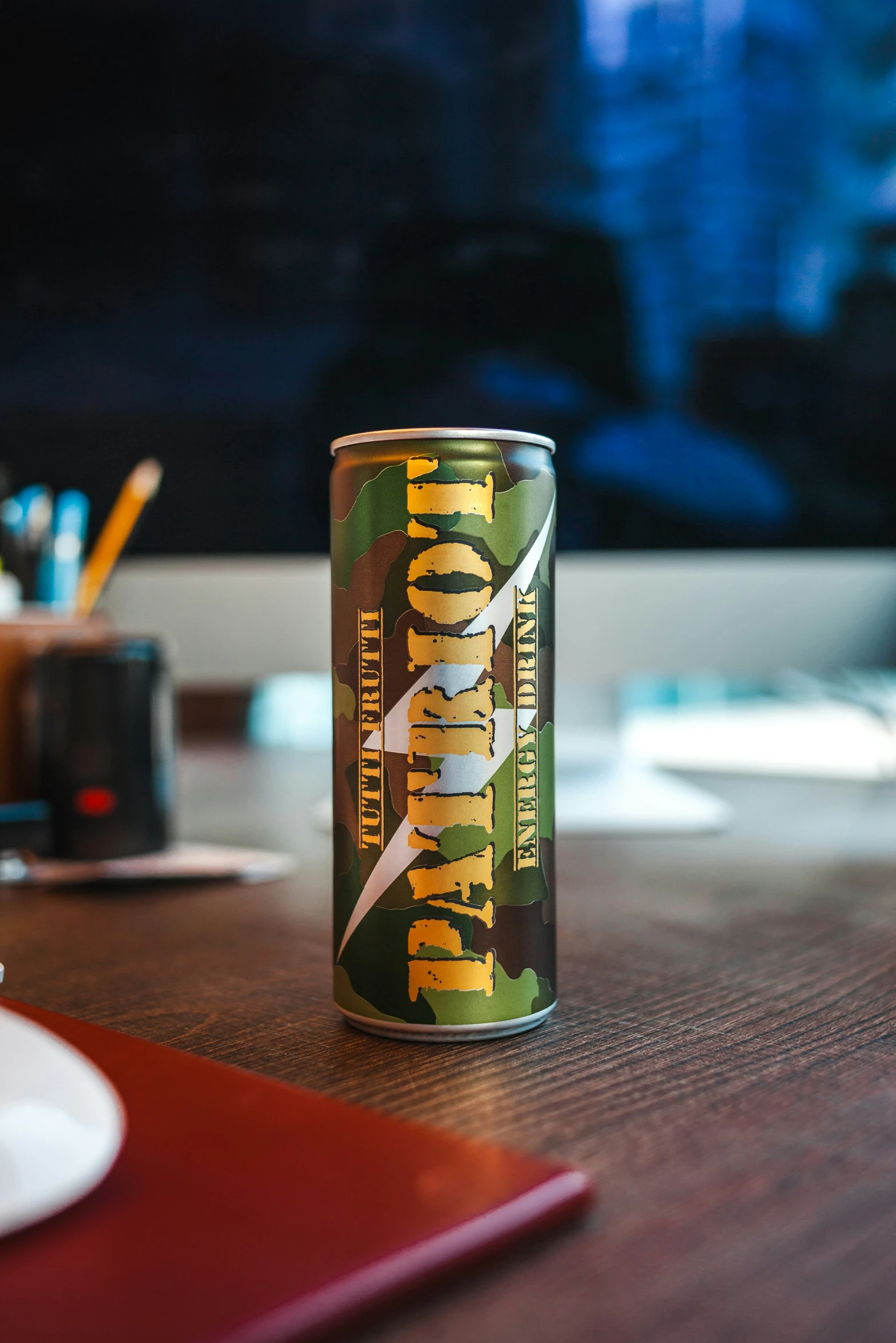 a can of energy drink on a table