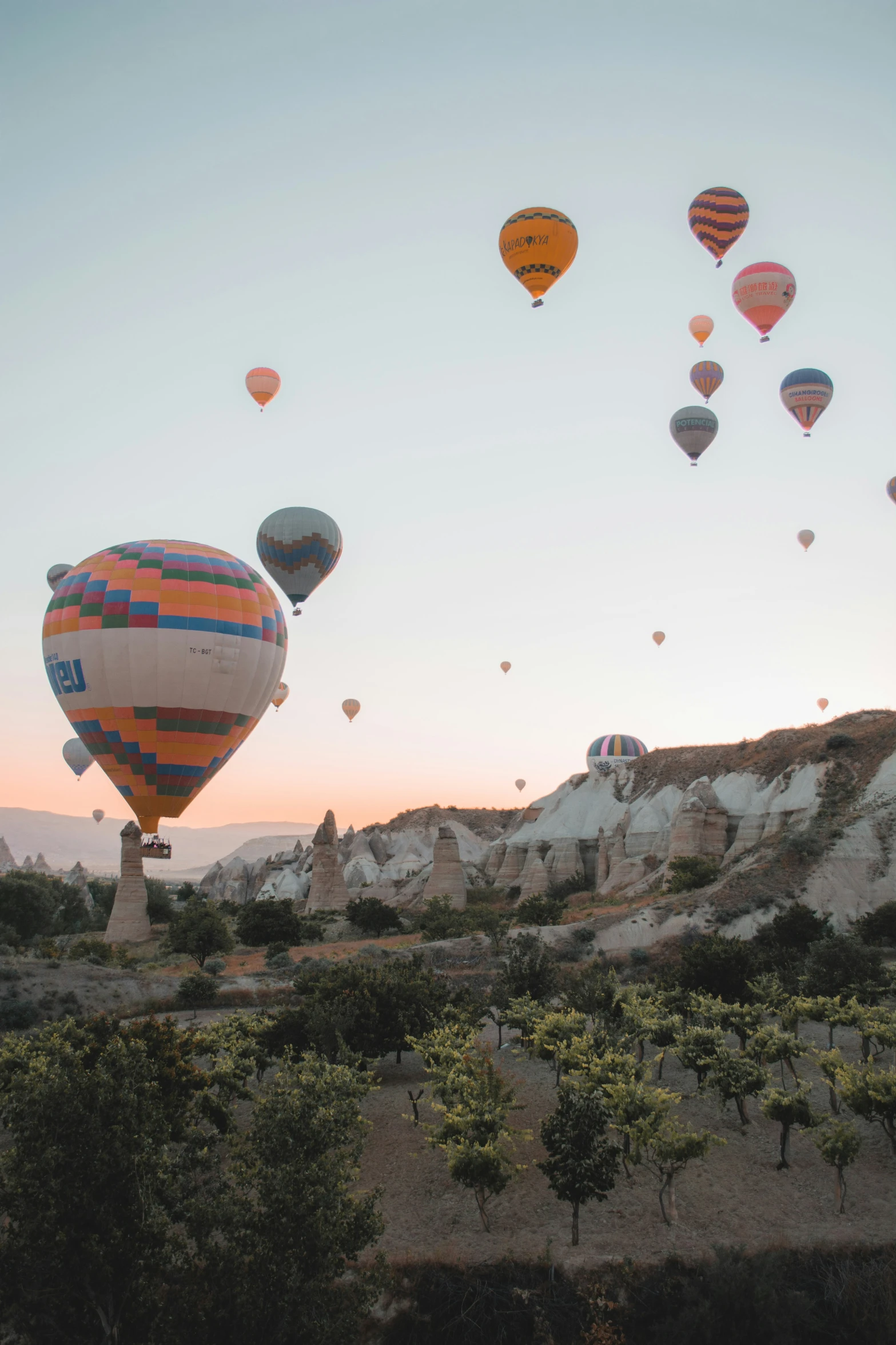 an assortment of balloons fly through the air