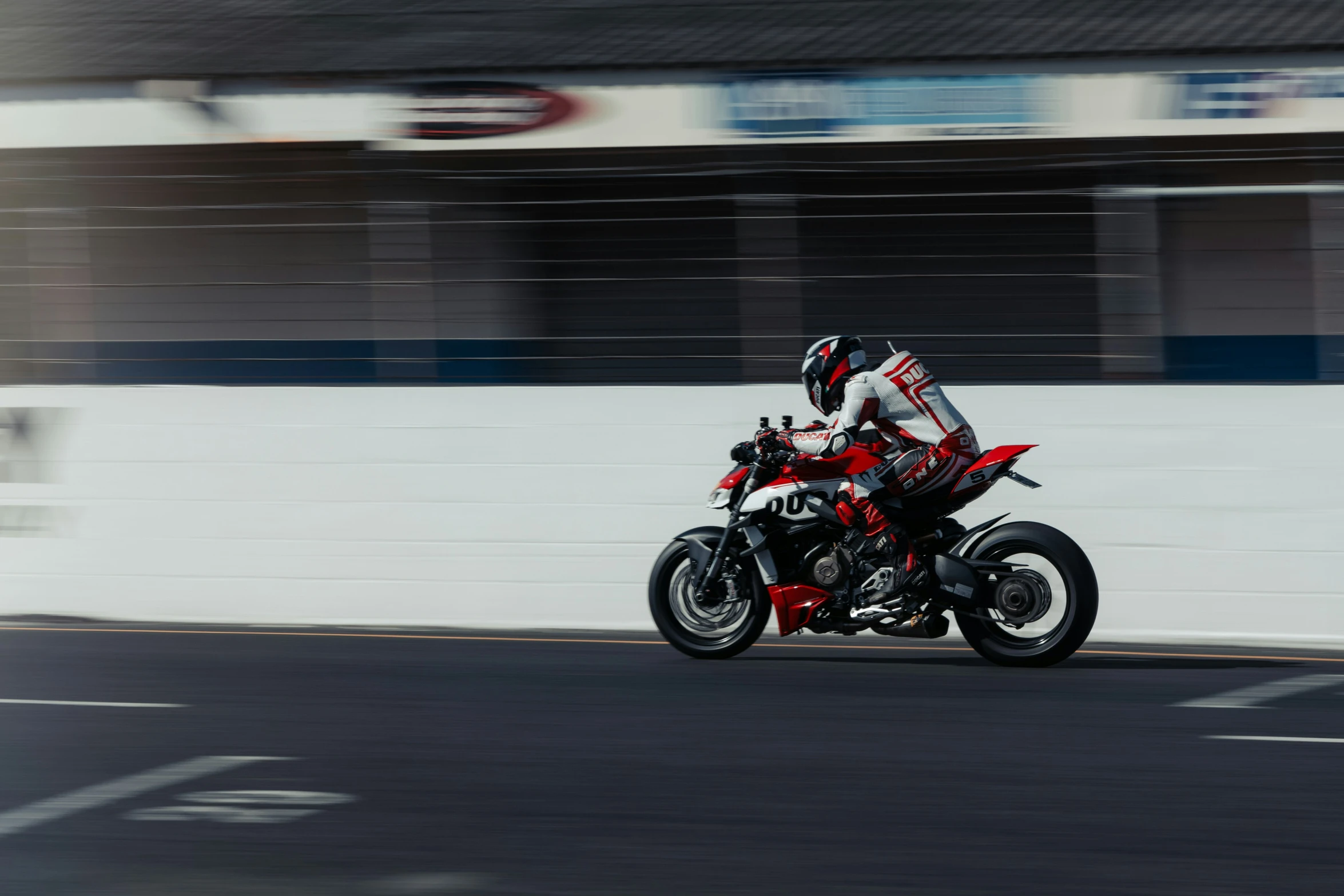 a guy on a motorcycle making a sharp right turn