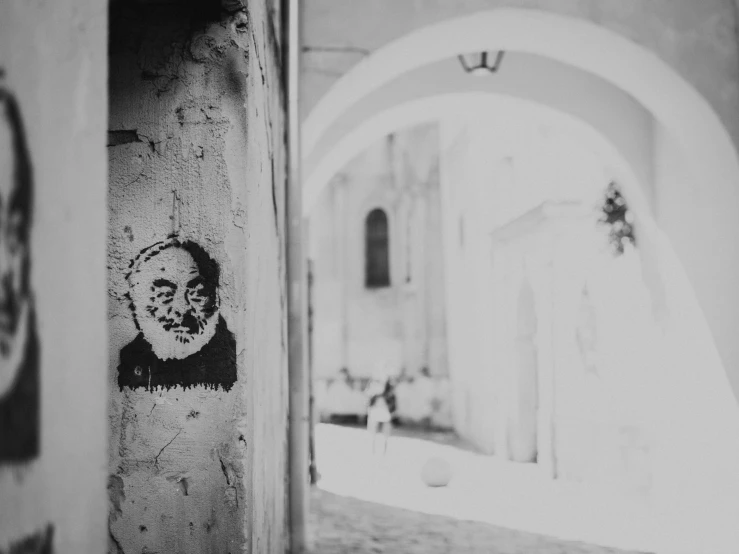 a large archway is decorated with street art