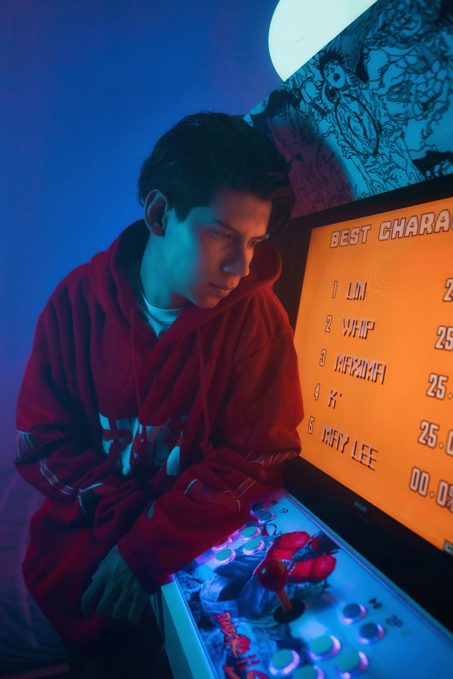 a man sitting in front of a video game machine