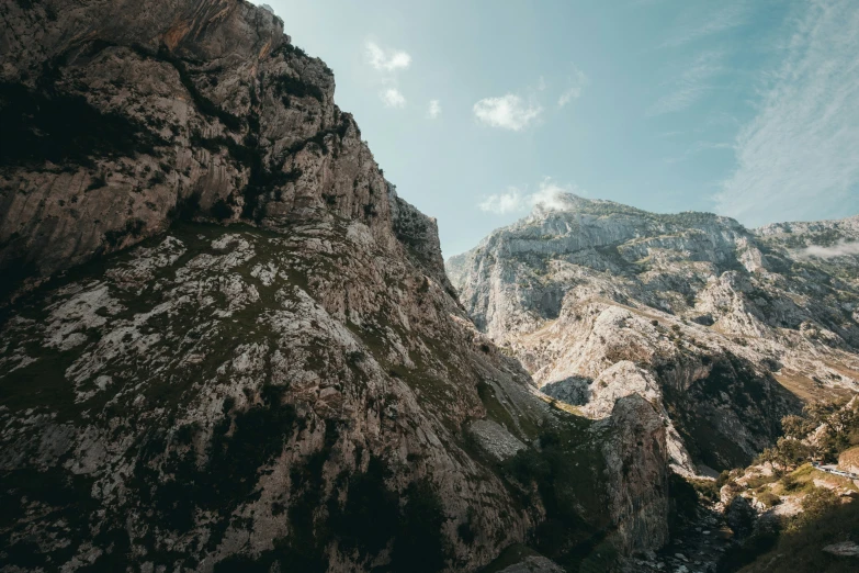 rocky mountain sides are seen in this image