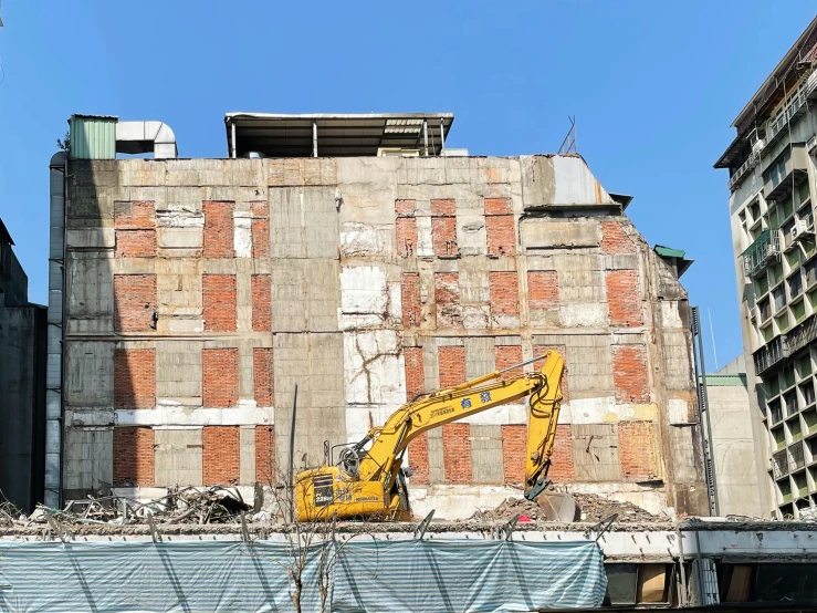 a construction site with some buildings and cranes