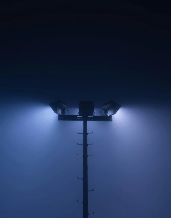 the two streetlights on the side of the road are lit by the headlights of their respective street lamps