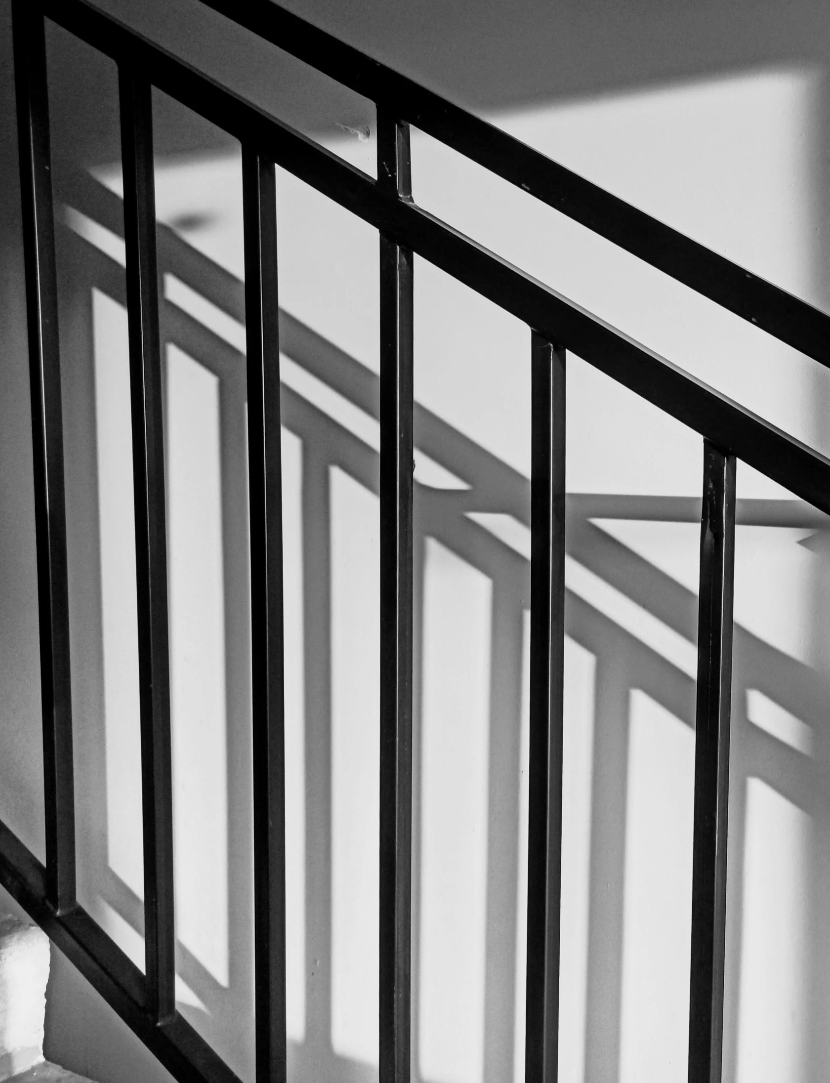 a picture of an unkempt railing with bars