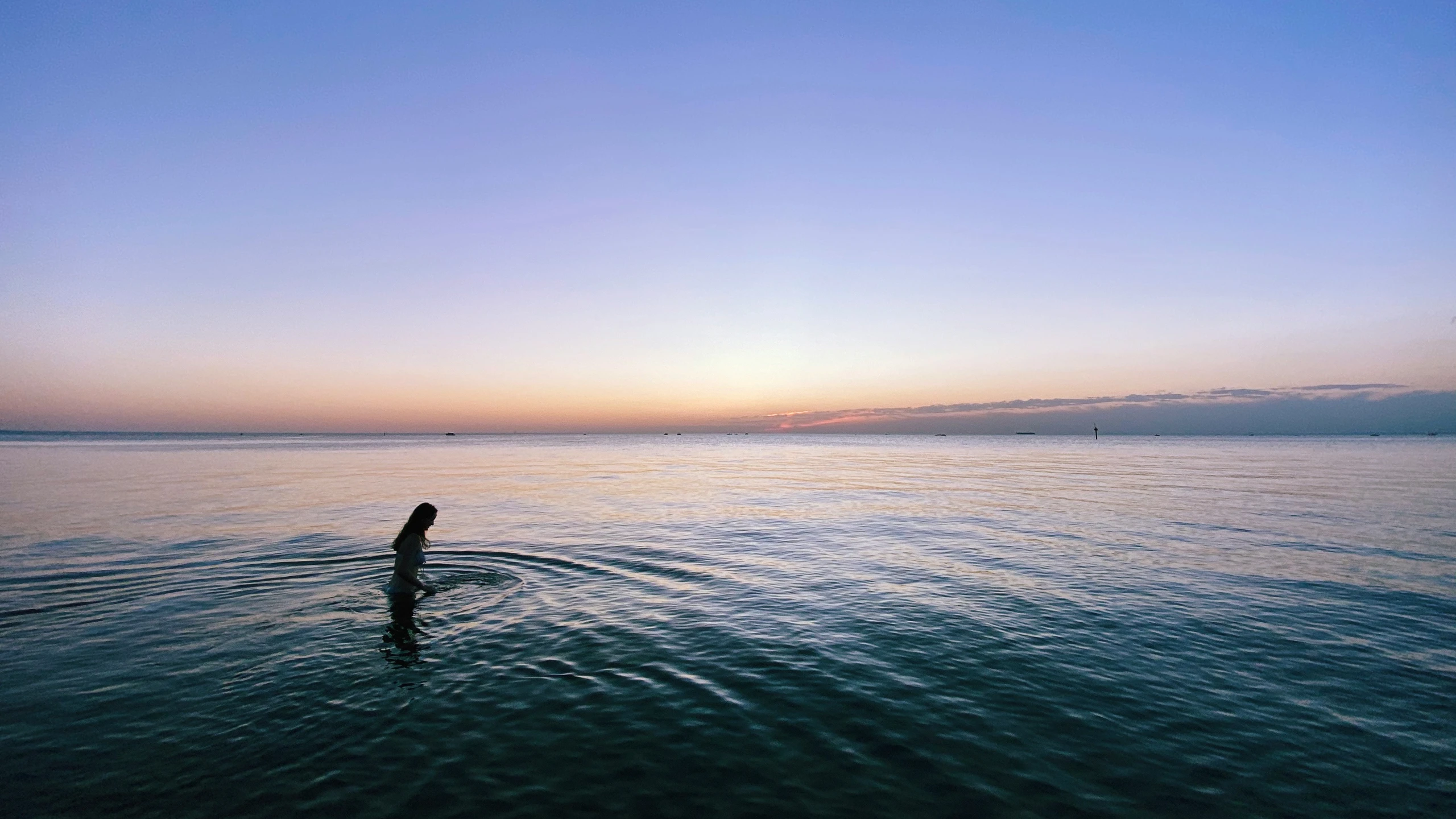 someone on their surfboard in the middle of a lake