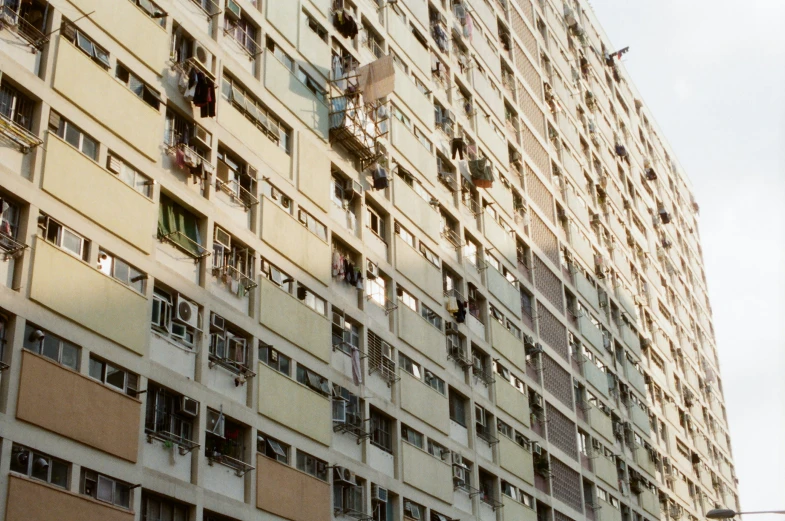 an old building with lots of windows and balconies on top