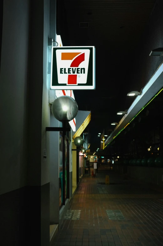 a gas station sign hanging off the side of a building