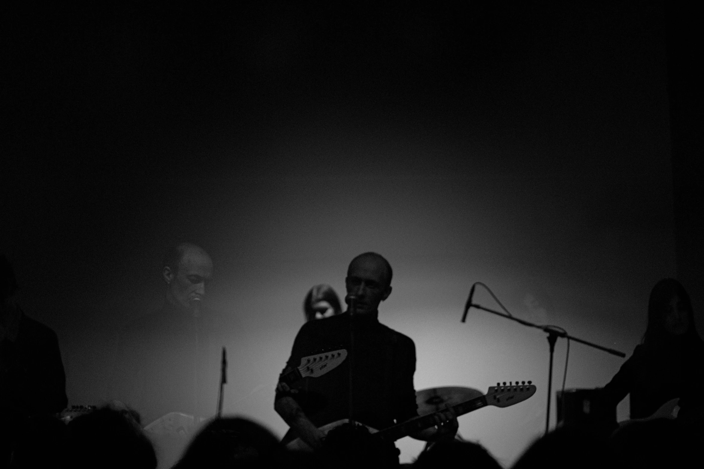 a person that is playing an electric guitar on stage