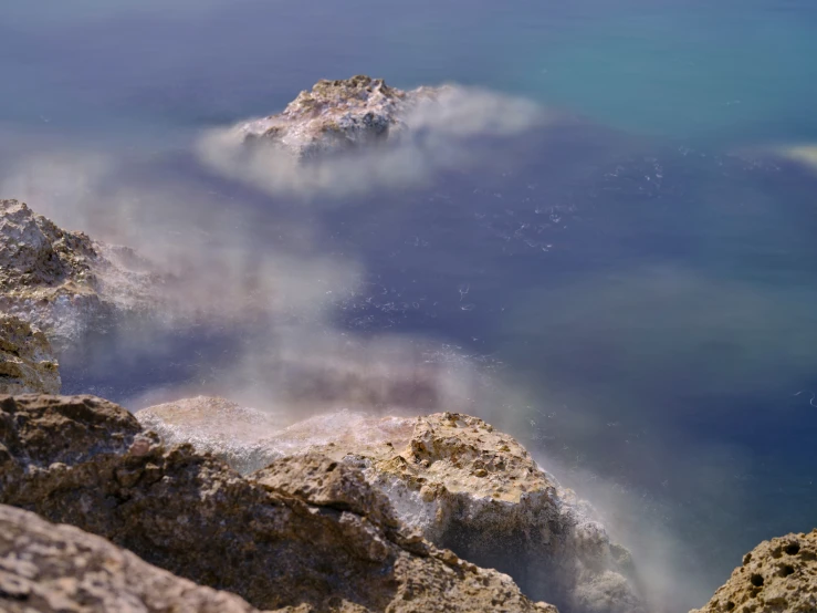 an island surrounded by water and rocks