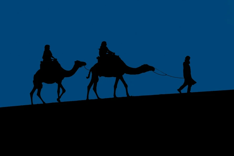 the silhouettes of people riding camels against a blue sky