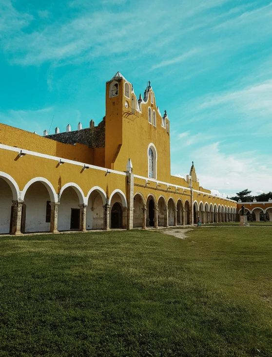 a large building with white arches and arches on the outside