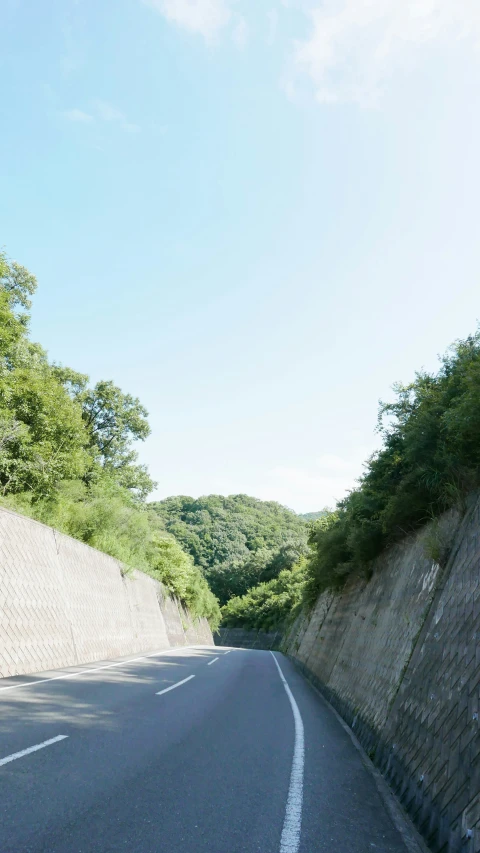 road with a small hill next to it