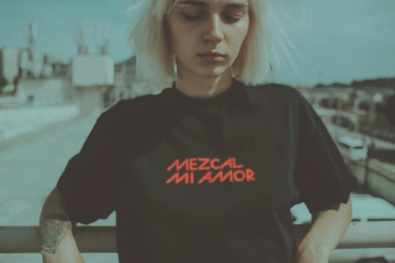 a person wearing a t shirt that says mezcal milamior