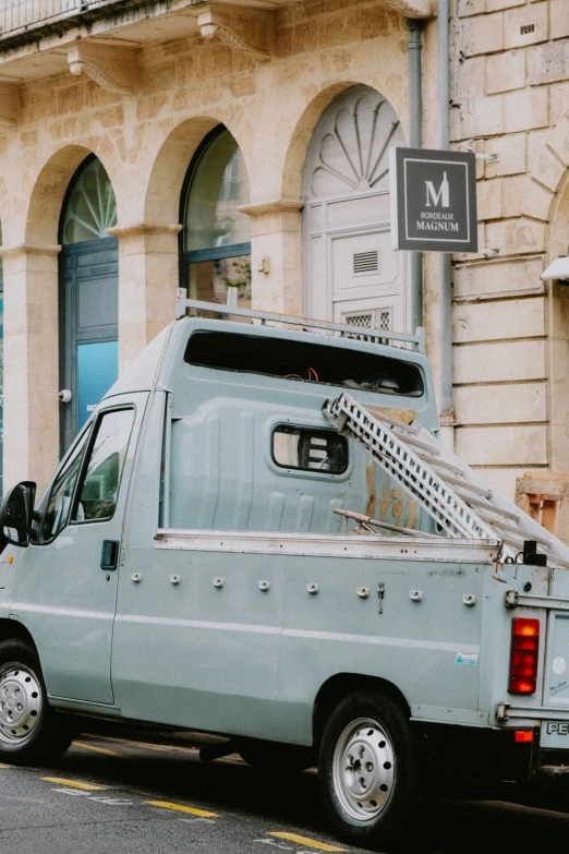 the van is sitting out side in the city