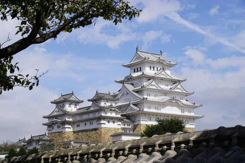 a tall white tower towering over a city