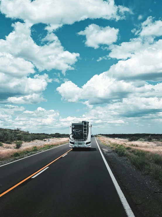 a big semi truck is going down the highway