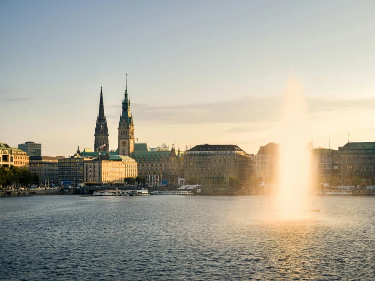 the beautiful city of rigash is illuminated by a water fountain