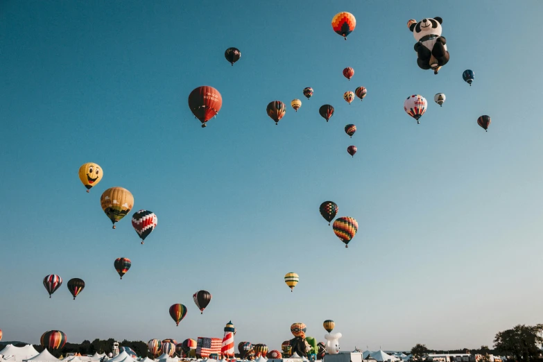 a bunch of  air balloons are flying in the sky