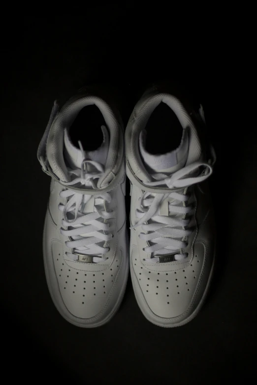 the sole of a pair of shoes is shown on a black background